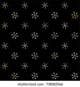 Christmas seamless background with random scatter falling silver and gold snowflakes isolated on black.