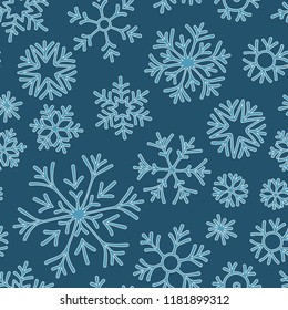 Christmas seamless doodle pattern with snowflakes.