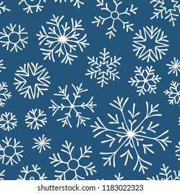 Christmas seamless doodle pattern with snowflakes.