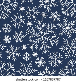 Christmas seamless doodle pattern with snowflakes.