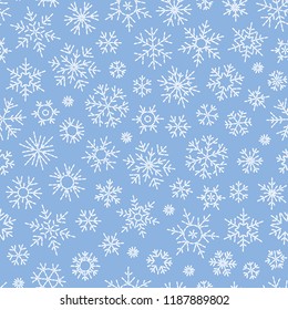 Christmas seamless doodle pattern with snowflakes.