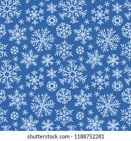 Christmas seamless doodle pattern with snowflakes.