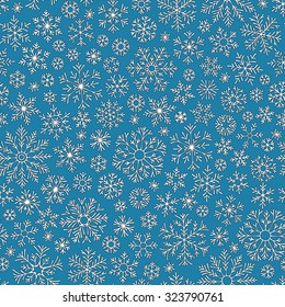 Christmas seamless doodle pattern with snowflakes, vector background