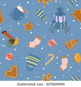 Christmas, seamless illustration with Christmas flashlight, branch spruce, sock, cap, mittens and Christmas gingerbread on a blue background. For decorating textiles, packaging.