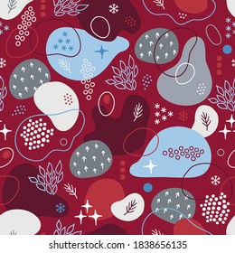 Christmas seamless pattern with abstract shapes, stars, snow, fir branches, leaves, dots, circles on red background. Perfect for holiday invitations, winter greeting cards, wallpaper and gift paper 