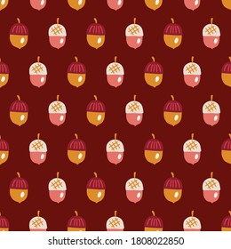 Christmas seamless pattern with acorns on dark red background. Perfect for gift paper, wallpaper, autumn and winter holidays, greeting cards 