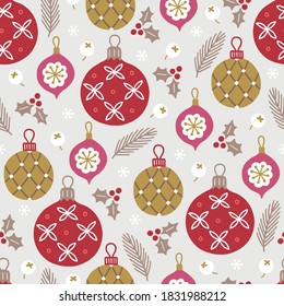 Christmas seamless pattern with balls, baubles, fir branches, holly berry, snowflakes on grey background. Perfect for winter greeting cards, Xmas, New Year decoration. Vector illustration
