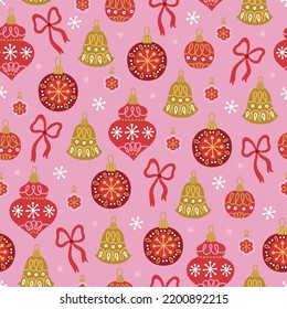 Christmas seamless pattern with balls, bells, baubles, bows, snowflakes on pink background. Perfect for winter greeting card, New Year decoration, wallpaper, fabric. Vector illustration