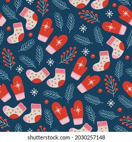 Christmas seamless pattern with berry, socks, mittens, snowflakes on dark blue background. Scandinavian style. Perfect for winter holidays, xmas wallpaper, wrapping paper, fabric. Vector illustration