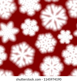 Christmas seamless pattern of big blurry snowflakes, white on red background