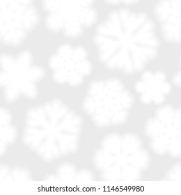 Christmas seamless pattern of big blurry snowflakes, white on light gray background
