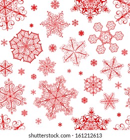 Christmas seamless pattern from big and small red snowflakes on white background