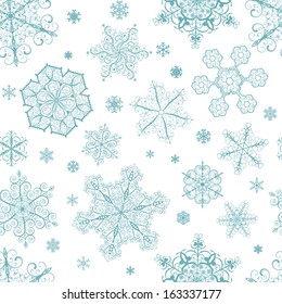 Christmas seamless pattern from big and small turquoise snowflakes on white background