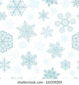 Christmas seamless pattern with big and small turquoise snowflakes on white background