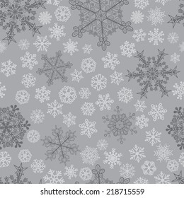 Christmas seamless pattern of big and small snowflakes, in gray colors