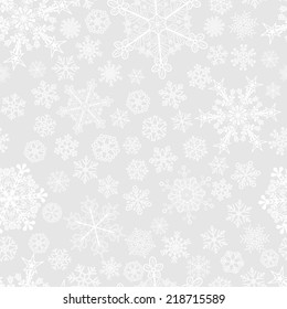 Christmas seamless pattern of big and small snowflakes, white on gray