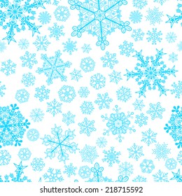 Christmas seamless pattern of big and small snowflakes, light blue on white