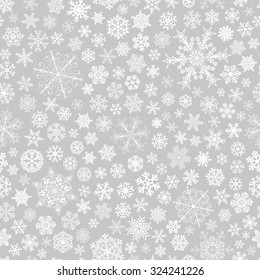 Christmas seamless pattern of big and small snowflakes, white on gray