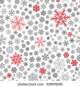 Christmas seamless pattern of big and small snowflakes, red and gray on white