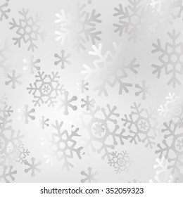 Christmas seamless pattern of big and small snowflakes, light gray on white.