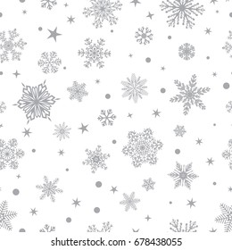 Christmas seamless pattern of big and small snowflakes, gray on white