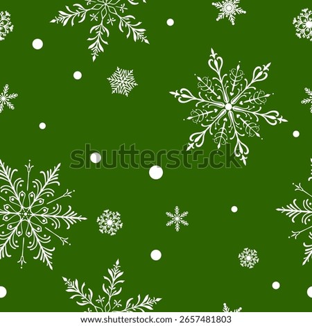Christmas seamless pattern with big and small intricate snowflakes in various designs and small circles, white on green background.