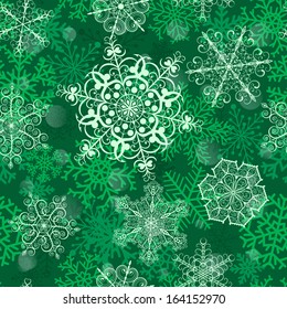 Christmas seamless pattern with big snowflakes on green background