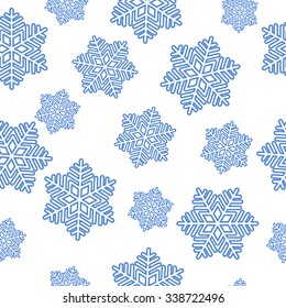 Christmas seamless pattern from blue snowflakes on white background. vector illustration