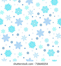 Christmas seamless pattern with blue snowflakes on white background. Winter New Year pattern.