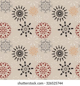 Christmas seamless pattern. Brown and orange snowflake signs on beige background. Winter theme retro texture. Chocolate snow. Vector illustration.