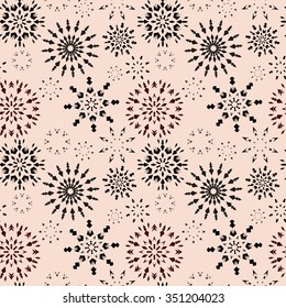 Christmas seamless pattern. Brown snowflake signs on light beige background. Winter theme retro texture. Chocolate snow. Vector illustration.