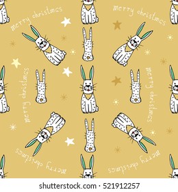 Christmas seamless pattern with bunny,star,lettering on the gold background.Trend pattern for the design of textile,clothing and other.