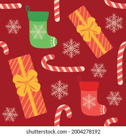 Christmas seamless pattern with candy cane, gift, stocking, bullfinch bird. Christmas wrapping paper