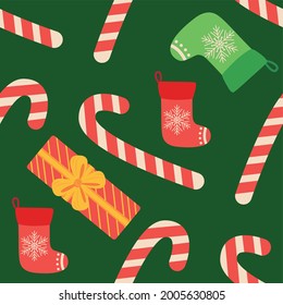 Christmas seamless pattern with candy cane, gift, stocking, bullfinch bird. Christmas wrapping paper