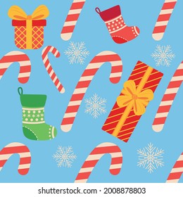 Christmas seamless pattern with candy cane, gift, stocking. Christmas wrapping paper.