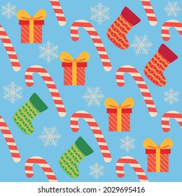 Christmas seamless pattern with candy cane, gift, stocking. Christmas wrapping paper.