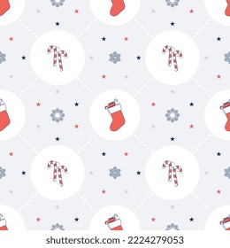 Christmas seamless pattern with candy cane and xmas stocking in flat design	