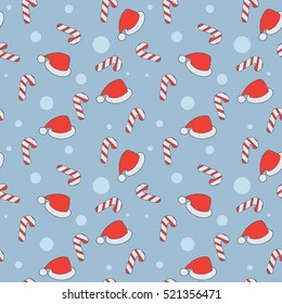 Christmas seamless pattern with candy canes and a Santa Claus hat.happy Christmas. sweet red white candies. flat design. light blue background