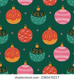 Christmas seamless pattern with colorful balls and snowflakes on green background. Perfect for wallpaper, gift paper, winter greeting cards. Vector illustration