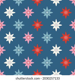 Christmas seamless pattern with colorful stars on blue background. Scandinavian style. Perfect for winter holidays, xmas wallpaper, wrapping paper, fabric. Vector illustration