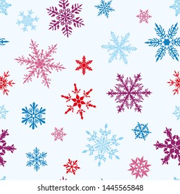 Christmas seamless pattern of complex big and small multicolored snowflakes on white background