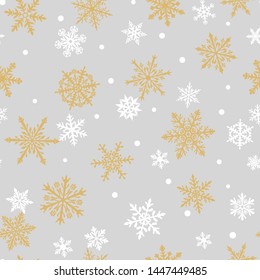 Christmas seamless pattern of complex big and small snowflakes in white and yellow colors on gray background