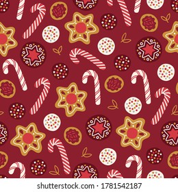 Christmas seamless pattern with cookies, leaves and candy stick on red background. Perfect for winter holidays, New Year greetings, gift paper, wallpaper