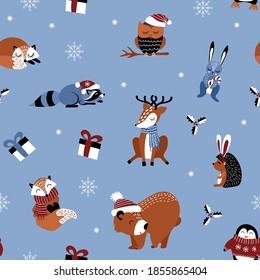 Christmas seamless pattern with cute woodland animals on light blue background. Vector illustration.