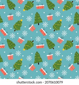 Christmas seamless pattern. Cute xmas different trees with decorations, winter holiday attributes, new year gifts and snowflakes on blue background. Decor textile wrapping paper, vector print
