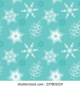 Christmas seamless pattern with different snowflakes on blue background