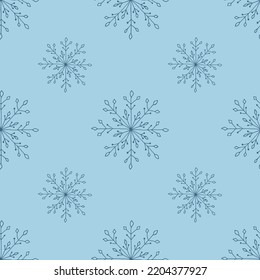Christmas seamless pattern with doodle snowflakes on a blue background.