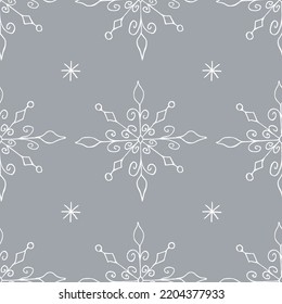 Christmas seamless pattern with doodle snowflakes on a gray background.