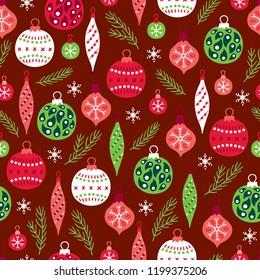 Christmas seamless pattern with fir branches, balls, baubles and snowflakes on dark red background. Perfect for holiday invitations, winter greeting cards, wallpaper and gift paper 