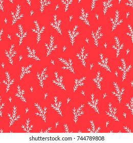 Christmas seamless pattern with fir branches on red background. Perfect for wallpaper and holiday decorations 